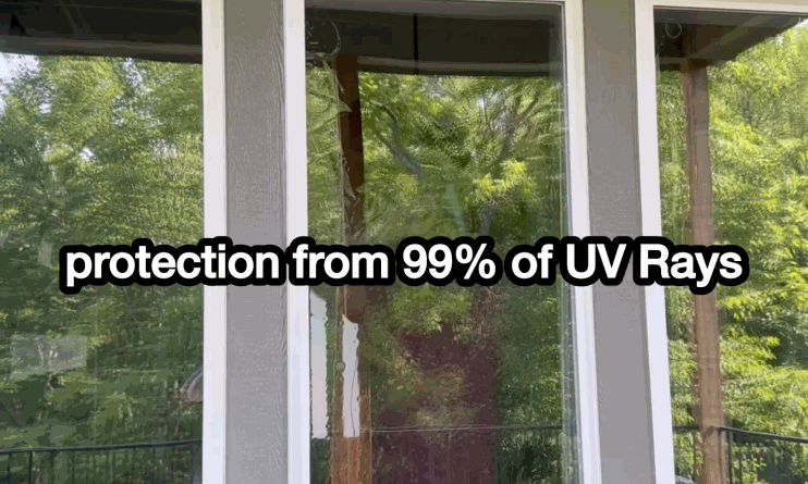 Outdoor view of home windows with the text “protection from 99% of UV Rays” overlaying the glass, emphasizing the UV-blocking benefit of home window tint.